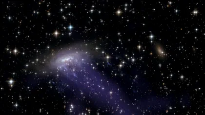 Astronomii au observat o galaxie cu tentacule de pe vremea când Universul era mult mai tânăr