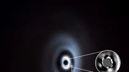 Un sistem solar în devenire? Două planete, surprinse în formare în discul unei stele tinere